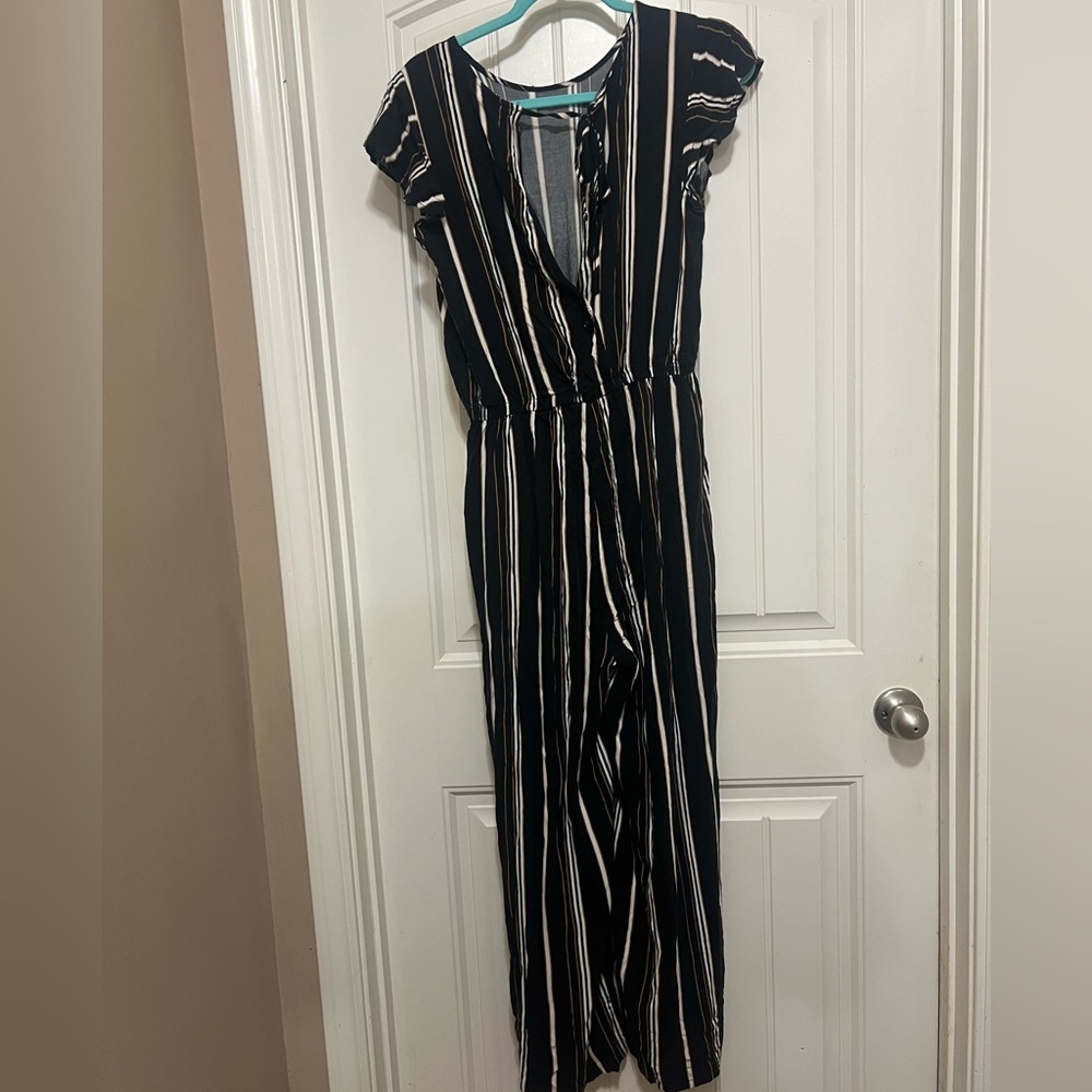 This is a romper. Gold,Black,and White. Used condition.
